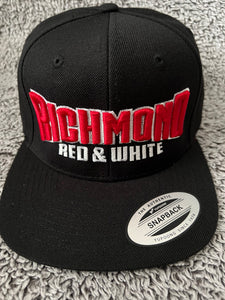 Red and white puff on black hat