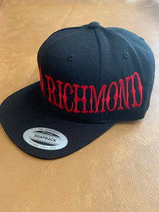 Black snap back hat with red writing