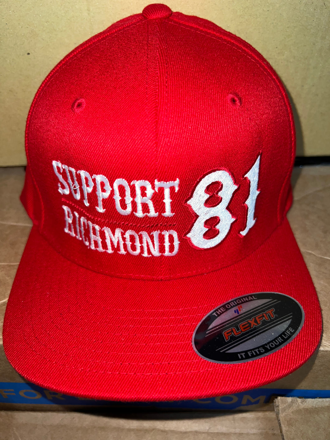 Red flex fit hat with white writing