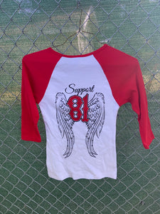 Red and white baseball t with wings on back